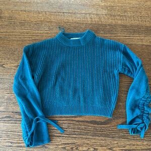 Emma & Sam teal sweater with ties on the sleeves, 100% acrylic